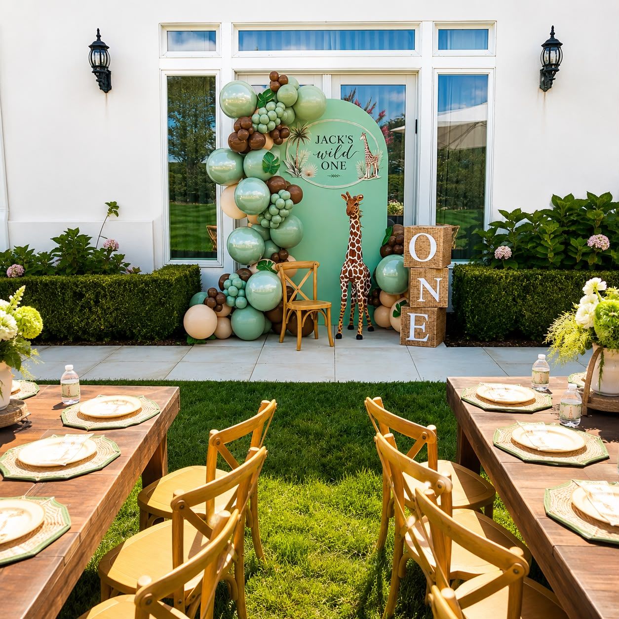 Wild One outdoor safari party with rattan children's chairs